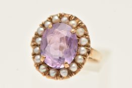 A 9CT GOLD AMETHYST AND SPLIT PEARL CLUSTER RING. Set with a central amethyst bordered by split