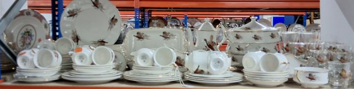 A SHERIDEN CHINA DINNER SERVICE WITH GLASSES, featured in the 'Flying Pheasant' pattern, two