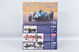 FOUR BOXED EBBRO PLASTIC 1:20 SCALE MODEL KITS WITH NEW IN BOX SEALED PARTS, to include a Team Lotus