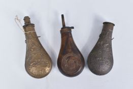 THREE 19TH CENTURY BRASS AND COPPER POWDER FLASKS, one of them has 'Muzzle Loaders Association' on