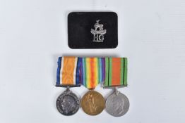 A WWI PAIR OF MEDALS, A WWII DEFENCE MEDAL AND HOME GUARD BADGE, the medals are correctly
