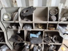 A LARGE SELECTION OF VINTAGE BRITISH MOTORCYCLE PARTS including saddles, footpegs, foot controls,