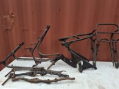 A COLLECTION OF 1950s BRITISH MOTORCYCLE FRAME PARTS, including three rear frames, one with a centre