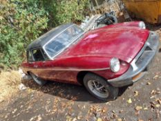 A 1977 MG B ROADSTER SPORTS CAR in red, with a 1798cc petrol engine, 4-speed manual gearbox,
