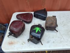 A COLLECTION OF VINTAGE BSA OIL TANKS AND TOOLBOXES, including two oil tanks with caps and an AJS