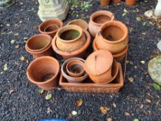 A QUANTITY OF TERRACOTTA PLANT POTS AND ORNAMENTS, including one oblong with detailing to the sides,