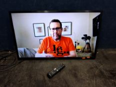 A SAMSUNG UE32T5300CK 32in SMART TV with remote, partial wall bracket fitted but no stand (PAT