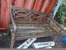 A WOODEN GARDEN BENCH with a slatted seat and curved detailing to the back, 161cm wide Condition