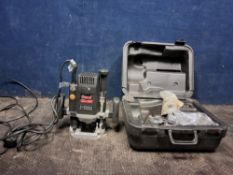 A CASED FREUD FT2000VCE 1/2in ROUTER with parallel guide and adapters (PAT passed and working)