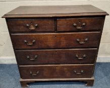 A GEORGIAN OAK CHEST OF TWO SHORT OVER THREE LONG GRADUATED DRAWERS, raised on bracket feet