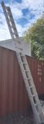 AN ALUMINIUM DOUBLE EXTENSION LADDER with 17 rungs to each 450cm section, along with a step ladder