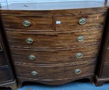 A GEORGIAN MAHOGANY BOW FRONT CHEST OF TWO SHORT OVER THREE LONG GRADUATED DRAWERS, raised on