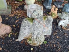 A CONCRETE EAGLE FIGURE with outstretched but folded wings, 42 cm high