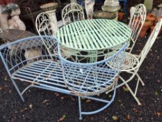 A METAL GARDEN TABLE ,FOUR FOLDING CHAIRS AND A CONVERSATION SEAT table top is 90cm in diameter