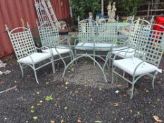 A METAL AND GLASS GARDEN TABLE WITH SIX CHAIRS with a 180cm glass top with curved ends Qty: 7