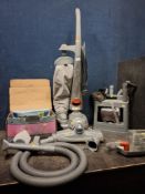 A KIRBY SENTRIA VACUUM CLEANER, with various accessories including spare pipes, carpet shampoo
