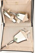 A CASED ART DECO SILVER AND ENAMEL DRESSING TABLE SET, comprising of a hair brush, hand held mirror,