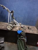 A POWAKADDY FREEWAY DIGITAL GOLF TROLLEY with battery, charger (PAT pass and working), a golf bag