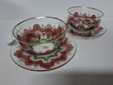 A PAIR OF THERESIENTHAL GLASS FINGERBOWLS AND STANDS, painted with pink flower petals, gilt rims,