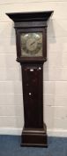 AN OAK CASED 30 HOUR LONGCASE CLOCK, the 12 inch brass dial depicting Roman numerals, signed James
