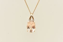 A 9CT YELLOW GOLD GEM SET PENDANT NECKLACE, an oval cut light brown beryl 'imperial beryl', prong