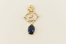 A 9CT YELLOW GOLD GEM SET PENDANT, an open work pendant set with an oval cut sapphire and round