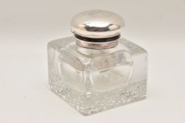 A HEAVY CUT GLASS AND SILVER MOUNTED INK WELL, of a square form, mounted with a hinged dome silver