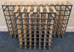 A SET OF THREE WOOD AND METAL WINE RACKS, each with forty-eight sections Dimensions:82cm x 63cm Qty: