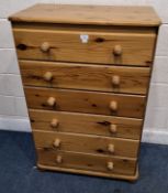 A MODERN PINE CHEST OF SIX DRAWERS, raised on bun feet Dimensions:width 79cm x depth 47cm x height