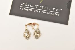 A PAIR OF 9CT YELLOW GOLD GEM SET EARRINGS, rectangular cut yellow green stone, assessed as '