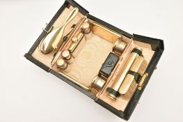 AN EARLY 20TH CENTURY 'ASPREY OF LONDON' SILVER GILT TRAVELLING VANITY SET, contents to include a