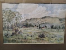 HENRY GEORGE GANDY (1879-1950) AN EXTENSIVE LANDSCAPE, an open landscape with distant buildings at