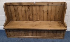 A LATE 20TH CENTURY PINE SETTLE, with a hinged seat Dimensions:width 183cm x depth 49cm x height