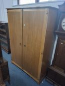 A LIGHT STAG MINSTREL TWO DOOR WARDROBE, width 129cm x depth 59cm x height 182cm Condition Report: