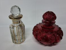 TWO GLASS SCENT BOTTLES, comprising a ruby glass scent bottle, of squat form, with cut decoration