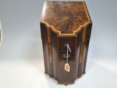 A GEORGIAN KNIFE BOX with a shaped front and intricate inlaid details to the rim and edges, raised