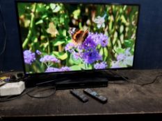 A SAMSUNG UE43KU6000K 43in SMART TV with remote and a Panasonic DVD player with remote (both PAT