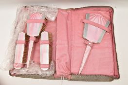 A MID 20TH CENTURY SILVER AND ENAMEL TRAVEL DRESSING TABLE SET, comprising of a hand held mirror,