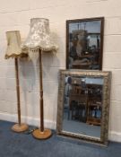 A RECTANGULAR BEVELLED EDGE WALL MIRROR, with foliate details to the frame, a smaller mirror with