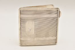 A GEORGE VI SILVER COMPACT, square form with engine turned pattern and vacant cartouche,