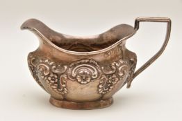 AN EDWARD VII SILVER MILK JUG, embossed floral detail, hallmarked 'John Edward Wilmot' Birmingham