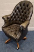 A GREEN LEATHER BUTTONED SWIVEL OFFICE CHAIR Dimensions:width 85cm x depth 74cm x maximum height