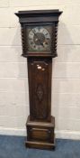AN EARLY 20TH CENTURY OAK CASED LONGCASE CLOCK, the glass door enclosing an 11.5-inch brass dial,