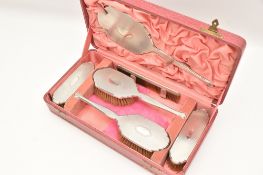 AN EARLY 20TH CENTURY CASED SILVER DRESSING TABLE SET, comprising of two hair brushes, two clothes