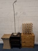 A MODERN PINE THREE DRAWER CHEST, a single drawer bedside, a wicker basket, a lamp and a wine rack
