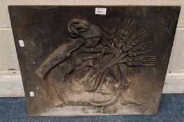 A CAST IRON FIREBACK, depicting a lady holding wheat and a sickle Dimensions:width 60cm x 50cm