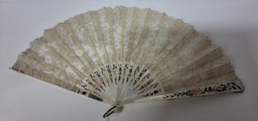 A BOXED MOTHER OF PEARL AND LACE FAN, the guards and ribs with applied gilt foliate motifs, in a