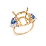 A sapphire and diamond set ring mount, composed of a cushion-shaped vacant collet, with shield-sh...