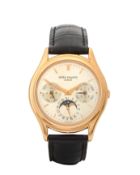 Patek Philippe. An 18ct rose gold perpetual calendar wristwatch  Ref: 3940R, Case No.2981617, Mov...