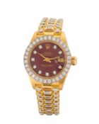 Rolex. An 18ct gold and diamond set bracelet watch with burgundy dial  Datejust, Ref: 6913, Seria...